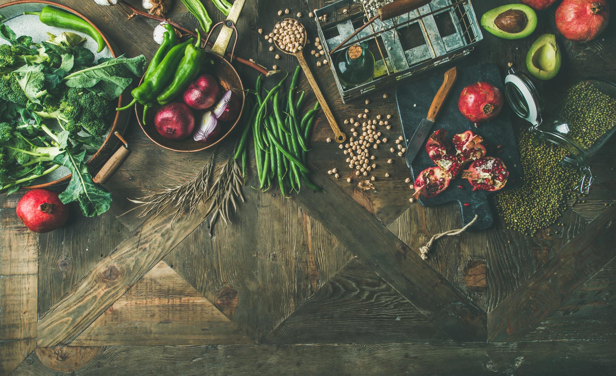 Rustic kitchen workspace with utensils and fresh produce